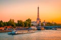 Sunset view of  Eiffel Tower, Alexander III Bridge and river Seine in Paris, France Royalty Free Stock Photo