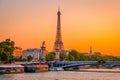 Sunset view of  Eiffel Tower, Alexander III Bridge and river Seine in Paris, France Royalty Free Stock Photo