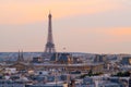 Sunset view of Eiffel Tower with Louvre museum, Notre-Dame cathedral, Parisian rooftops. Royalty Free Stock Photo