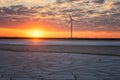 Wind farm and the salted lake Syvash at sunset light, scenic industrial and nature landscape, Kherson oblast, Ukraine