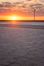 Wind farm and the salted lake Syvash at sunset light, scenic industrial and nature landscape, Kherson oblast, Ukraine