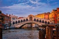 Sunset view of famous bridge of Rialto or ponte di Rialto over Grand Canal, Venice, Italy. Iconic travel destination of