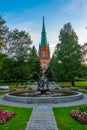 Sunset view of a fountain in front of the Alexander Church in Fi