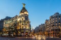 Sunset view of Gran Via and Metropolis Building Edificio Metropolis in City of Madrid, Spain Royalty Free Stock Photo