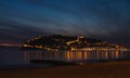 Sunset view of harbor, sea and fortress in Alanya, Turkey. Royalty Free Stock Photo