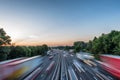 Sunset view heavy traffic moving at speed on UK motorway in England Royalty Free Stock Photo