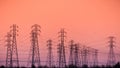 Sunset view of high voltage electricity towers on the shoreline of San Francisco bay area; California Royalty Free Stock Photo