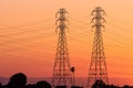 Sunset view of high voltage electricity towers on the shoreline of San Francisco bay area; California Royalty Free Stock Photo