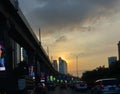 sunset view on the highway with lots of cars in the middle of jakarta traffic