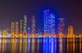 Sunset view of the Khalid lagoon surrounded with skyscraper in the emirate Sharjah, UAE