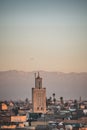 Sunset view of Koutoubia mosque in Marrakesh, Morocco with stork silhouette. Panoramic view of Marrakech with the old