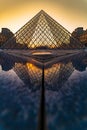 Sunset view of the Louvre museum reflection