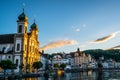 Sunset view in Lucerne with last sunray illuminating the beautiful Jesuit church in Lucerne old town Switzerland