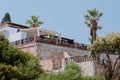 Sunset view of mansions built on top of cliffs on the Pacific Ocean coast, Malibu, Los Angeles county, California