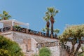 Sunset view of mansions built on top of cliffs on the Pacific Ocean coast, Malibu, Los Angeles county, California