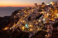 Sunset view of Oia town on Santorini in Greece Royalty Free Stock Photo