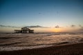 Sunset view on old Brighton pier and beach Royalty Free Stock Photo