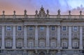 Sunset view of the ornate baroque architecture of the Royal Palace viewed from Plaza de Oriente in Madrid, Spain