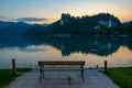 Sunset view over a bench looking at Bled castle in Slovenia Royalty Free Stock Photo