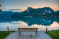 Sunset view over a bench looking at Bled castle in Slovenia Royalty Free Stock Photo