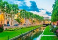 Sunset view over La Bassa river flowing through the city center of Perpignan, France Royalty Free Stock Photo