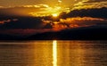 Sunset view over the lake and mountains. Cloudy sky. Bursa, Turkey