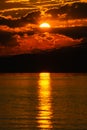 Sunset view over the lake and mountains. Cloudy sky. Iznik, Bursa, Turkey Royalty Free Stock Photo