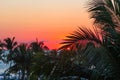 Fiery sunset over the Pacific Ocean, seen from a relaxing pool. Royalty Free Stock Photo