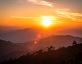 Fiery sunset above layered mountain ridges in Sarangkot, Nepal. The sun sets over mis Royalty Free Stock Photo