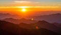 Fiery sunset above layered mountain ridges in Sarangkot, Nepal. The sun sets over mis Royalty Free Stock Photo