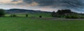 The Jeker valley near Maastricht during a sunset with dramatic clouds over the rolling hills Royalty Free Stock Photo