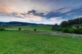 The Jeker valley near Maastricht during a sunset with dramatic clouds over the rolling hills Royalty Free Stock Photo