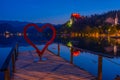 Sunset view over a romantic pier at lake Bled in Slovenia Royalty Free Stock Photo