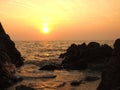 Sunset view over sea with stones Royalty Free Stock Photo
