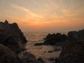 Sunset view over sea with stones Royalty Free Stock Photo