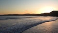 Sunset view of the Pacific Ocean shoreline; Drakes Beach, Point Reyes National Shoreline, California