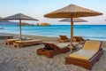 Sunset view of parasols and sunbeds at Vai beach at Crete, Greec Royalty Free Stock Photo