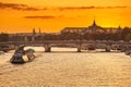 view Of Paris bridges, Grand Palace and cruise ship on the river Seine Royalty Free Stock Photo