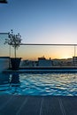 Sunset view by the pool on urban area Royalty Free Stock Photo