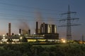 Sunset view at power plant with electricity pylon in Germany Royalty Free Stock Photo