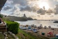 Sunset view of Praia do Porto with Morro do Pico on background from Mergulhao Restaurant - Fernando de Noronha, Pernambuco, Brazil