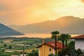View of rural Southern Switzerland with houses, farms, vineyards, alps mountains and Lake Maggiore