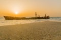 Sunset view of a rusty shipwreck in HaBonim Beach