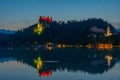 Sunset view of Saint Martin church and Bled castle in Slovenia Royalty Free Stock Photo