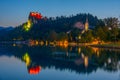 Sunset view of Saint Martin church and Bled castle in Slovenia Royalty Free Stock Photo