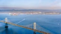 Sunset view of San Francisco Bay and the Bay Bridge; Oakland and the smoke plume from Kincade fire visible in the background; San Royalty Free Stock Photo