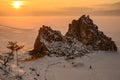 Sunset view of Shaman rock one of sacred place in frozen lake Baikal in winter season of Siberia, Russia. Royalty Free Stock Photo