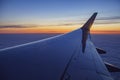 Sunset view of sky from a window seat in an airplane Royalty Free Stock Photo