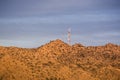 Sunset view of telecommunications tower on top of a hill close to the north border of Joshua Tree National Park, south California Royalty Free Stock Photo