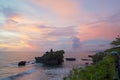 Sunset view of the temple Pura Tanah Lot from the coastal cafe Royalty Free Stock Photo